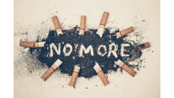 The words 'no more' surrounded by cigarette butts
